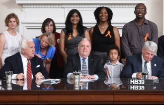 Volunteers from Start School Later Maryland pose with Gov. Larry Hogan and legislators at the 
